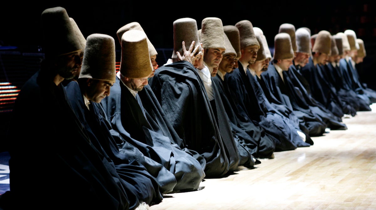  Dervishes pray during a 