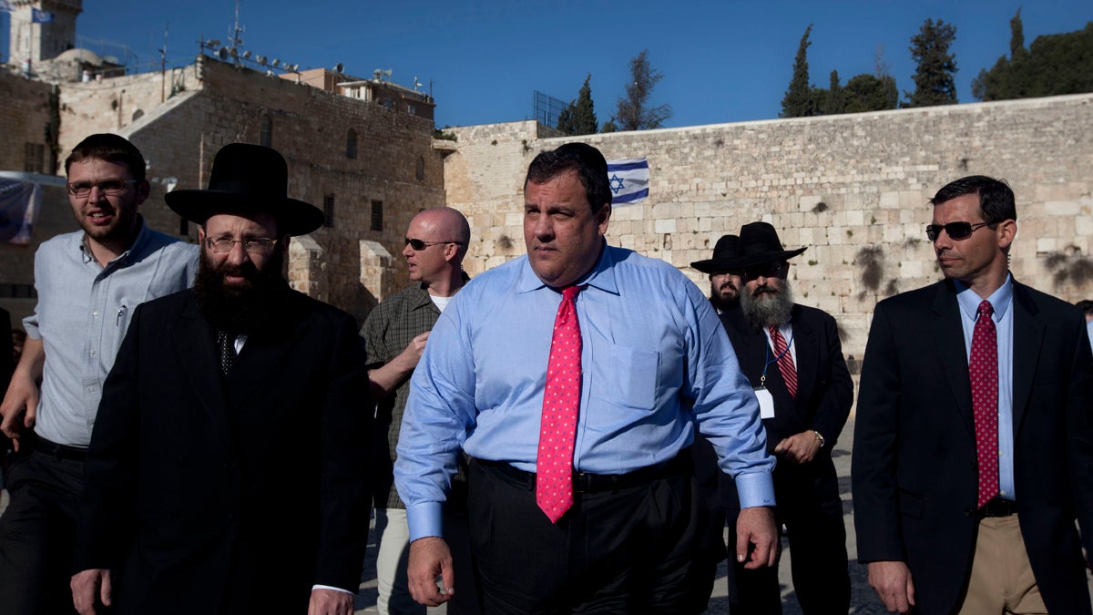  New Jersey Gov. Chris Christie, center, walks at the Western Wall, the holiest site where Jews can pray, during his visit to Jerusalem's old city in 2012. (AP file photo) 