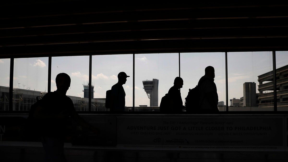 Some workers at Philadelphia International Airportsay they may go on strike while the Democrats are in town for the national convention at the end of the month. Travelers make their way through the Philadelphia International in May. (AP Photo/Matt Slocum)