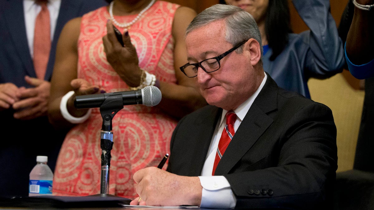  Mayor Jim Kenney signs into law a 1.5 cent-per-ounce tax on sugary and diet beverages at City Hall in Philadelphia, Monday, June 20, 2016. The tax will be levied on distributors and is set to take effect Jan. 1. (AP Photo/Matt Rourke) 