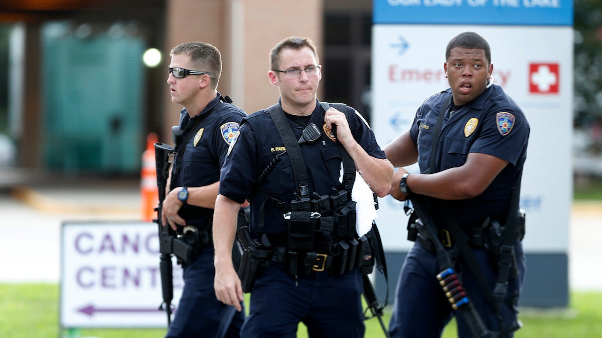 Police guard the emergency room entrance of Our Lady Of The Lake Medical Center