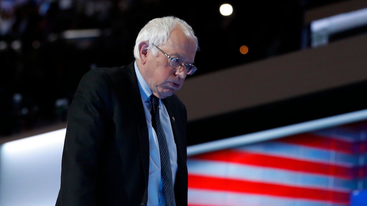 Former Democratic presidential candidate Sen. Bernie Sanders walks off the stage after speaking to delegates during the first day of the Democratic National Convention in Philadelphia Monday. (AP Photo/Carolyn Kaster)