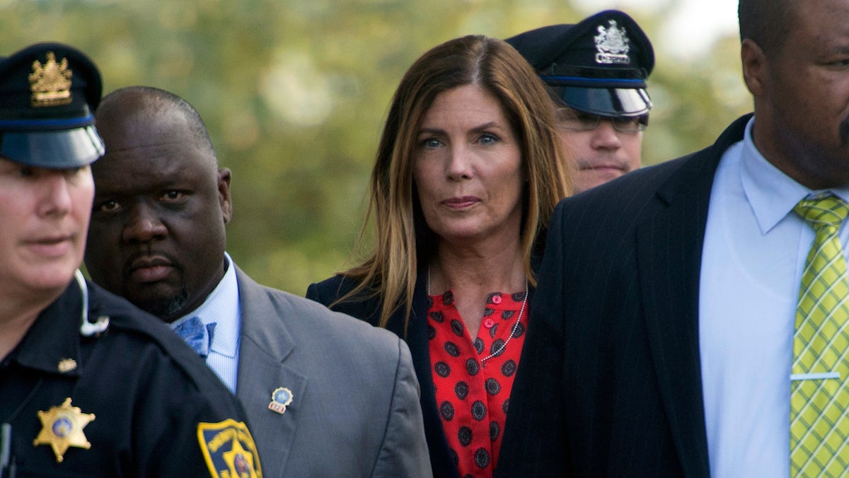  Pennsylvania Attorney General Kathleen Kane, center, leaves the Montgomery County courtroom where her trial for leaking grand jury testimony and then lying about it is underway, Wednesday. Aug. 10, 2016, in Norristown, Pa. (Clem Murray/Philadelphia Inquirer via AP, Pool) 