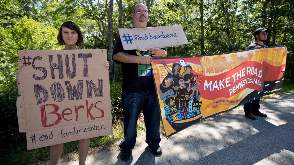 Protesters stand on a roadside in Edgartown