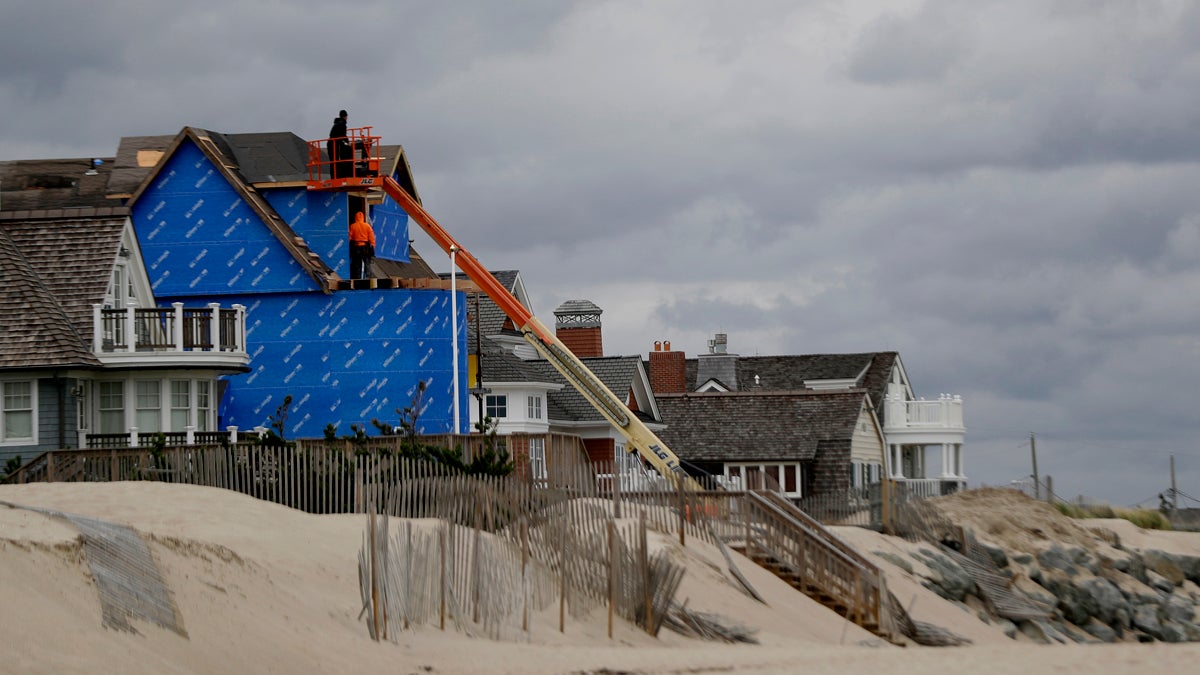 Construction workers labor on a beachfront home in Bay Head