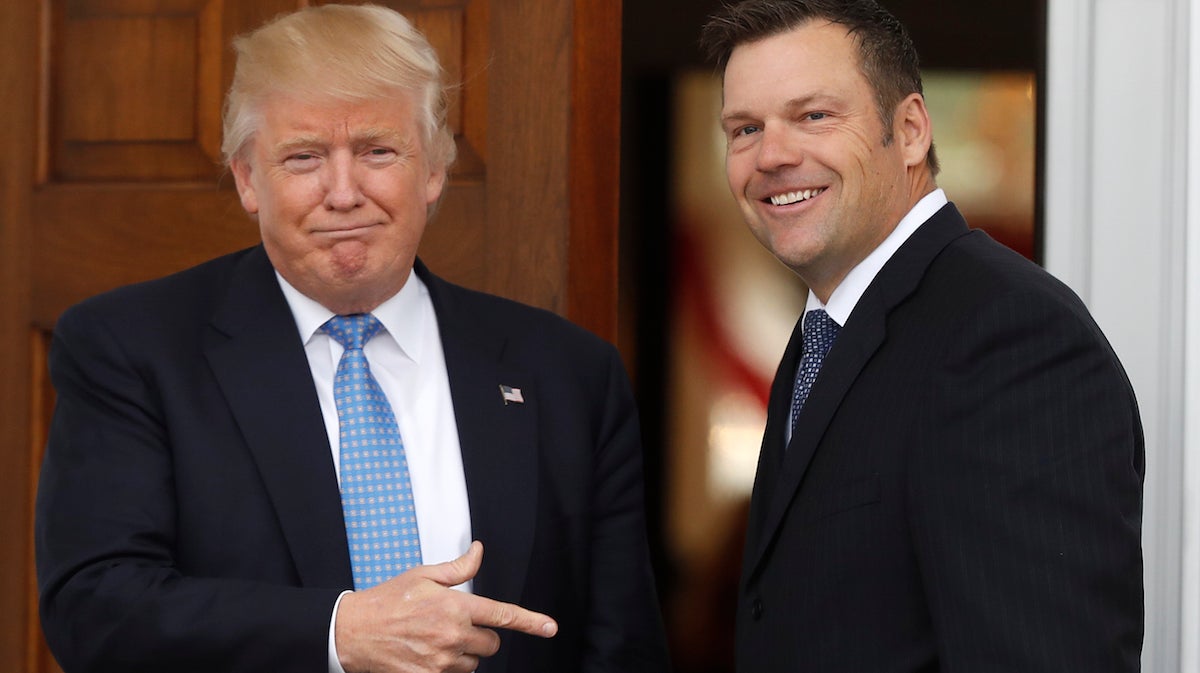  President-elect Donald Trump greets Kansas Secretary of State, Kris Kobach, as he arrive at the Trump National Golf Club Bedminster clubhouse, Sunday, Nov. 20, 2016, in Bedminster, N.J. (AP Photo/Carolyn Kaster) 