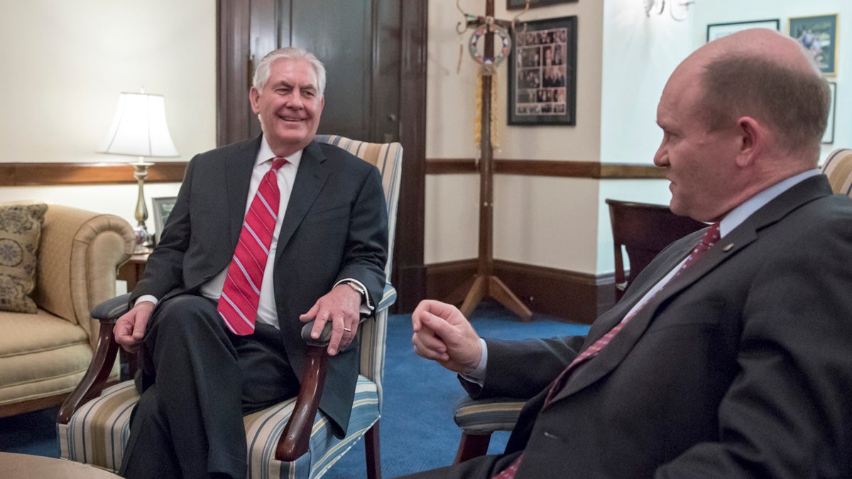  Secretary of State-designate Rex Tillerson (left) meets with Senate Foreign Relations Committee member Sen. Chris Coons, D-Delaware, Wednesday in Washington. The committee will conduct Tillerson's confirmation hearing. (AP Photo/J. Scott Applewhite 