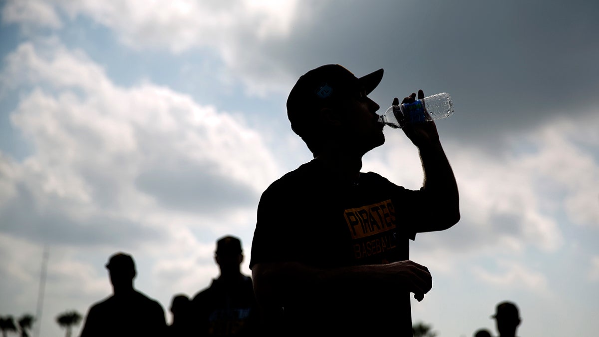  The city of Pittsburgh’s water and sewer authority will be restructured in the near future. In this photo from Feb. 14, 2017, Adam Frazier of the Pittsburgh Pirates takes a drink after a spring training workout in Florida. (AP Photo/David Goldman)  