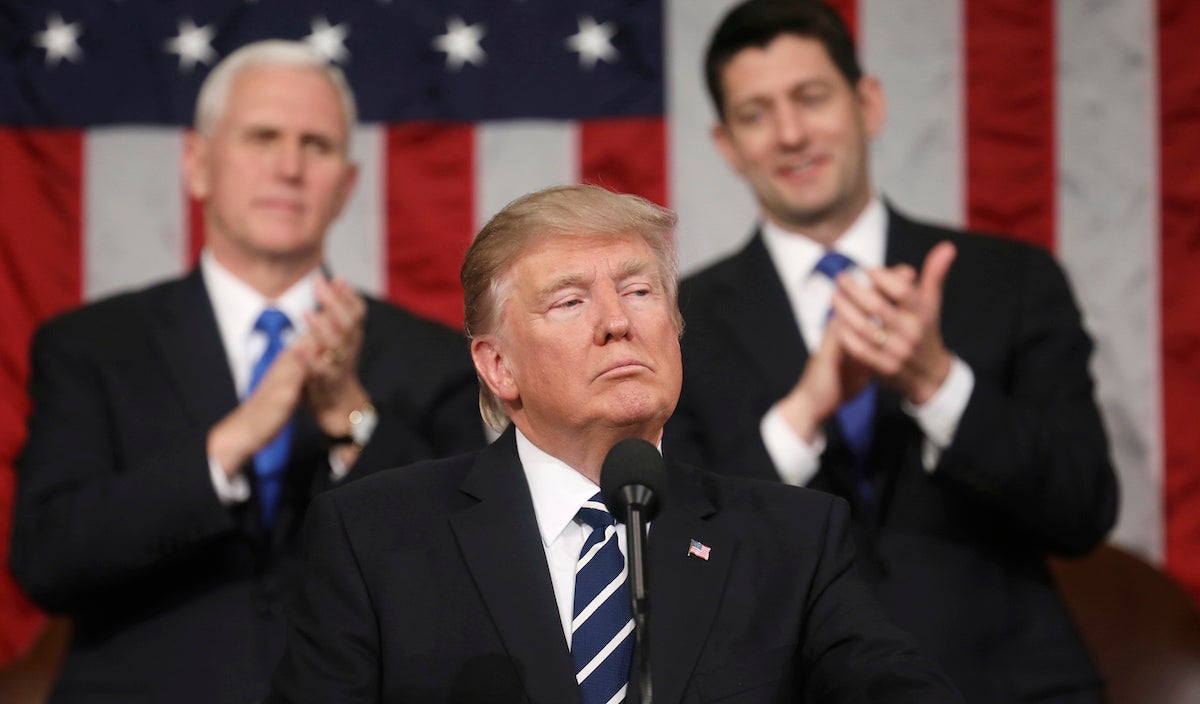  President Donald Trump addresses a joint session of Congress on Capitol Hill in Washington, Tuesday, Feb. 28, 2017, as Vice President Mike Pence and House Speaker Paul Ryan of Wis., listen. (Jim Lo Scalzo/Pool Image via AP) 