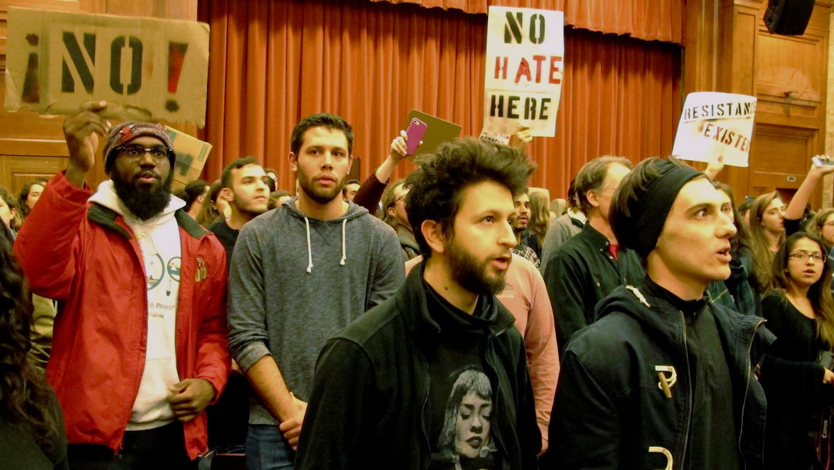  Middlebury College students turn their backs to Charles Murray, unseen, during his lecture in Middlebury, Vt., Thursday, March 2, 2017. Hundreds of college students protested his lecture, forcing the college to move his talk to an undisclosed campus location from which it was live-streamed to the original venue. He still could not be heard above protesters' chants, feet stamping and occasional smoke alarms. (AP Photo/Lisa Rathke) 
