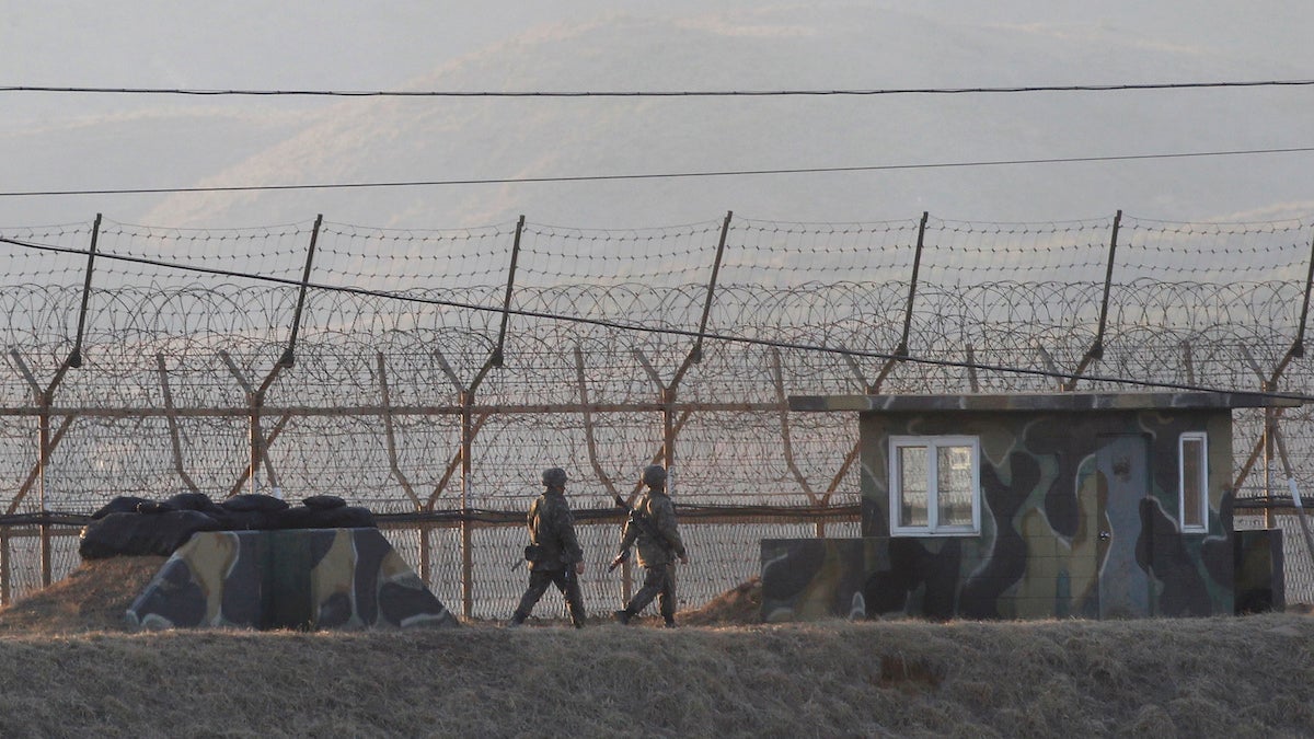  South Korean army soldiers patrol along the barbed-wire fence in Paju, South Korea, near the border with North Korea, Monday, March 6, 2017. North Korea on Monday fired four banned ballistic missiles that flew about 1,000 kilometers (620 miles), with three of them landing in Japan's exclusive economic zone, South Korean and Japanese officials said, in an apparent reaction to huge military drills by Washington and Seoul that Pyongyang insists are an invasion rehearsal. (AP Photo/Ahn Young-joon) 