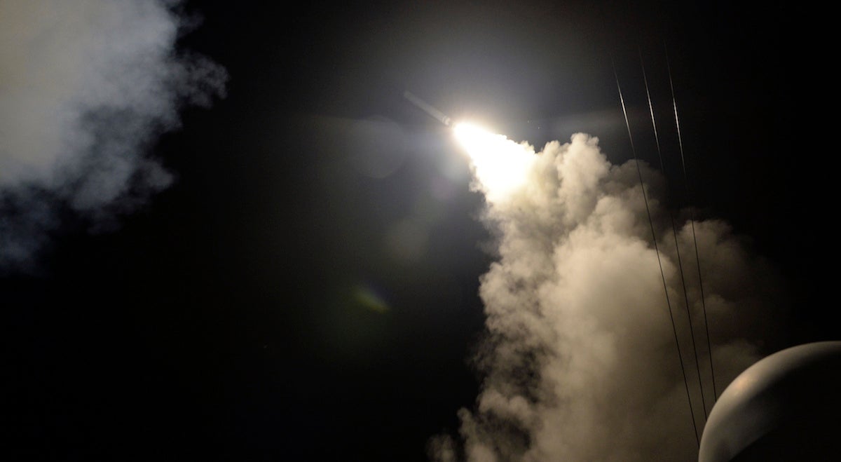  In this image provided by the U.S. Navy, the guided-missile destroyer USS Porter (DDG 78) launches a tomahawk land attack missile in the Mediterranean Sea, Friday, April 7, 2017. The United States blasted a Syrian air base with a barrage of cruise missiles in fiery retaliation for this week's gruesome chemical weapons attack against civilians. (Mass Communication Specialist 3rd Class Ford Williams/U.S. Navy via AP) 