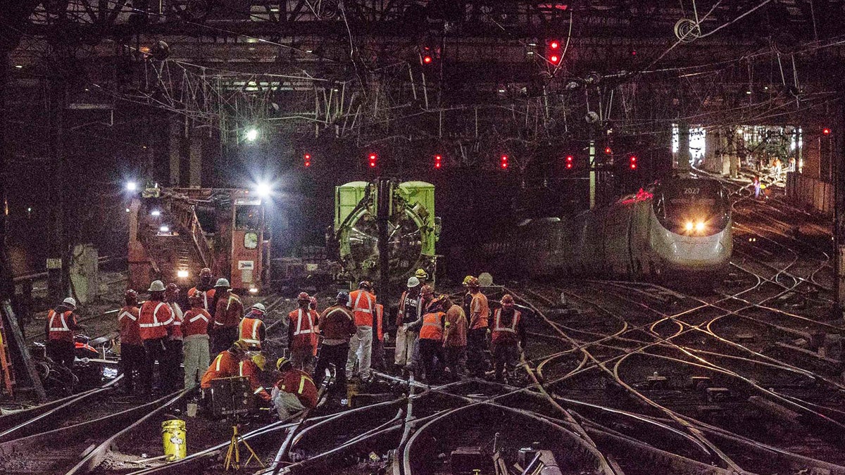  Workers repair rails inside New York's Penn Station. Accelerated repair work in the wake of recent breakdowns at New York’s Penn Station will begin in May and cause delays this summer for rail travelers who already have endured major disruptions recently, Amtrak officials said Thursday. (Chuck Gomez/Amtrak via AP, file) 