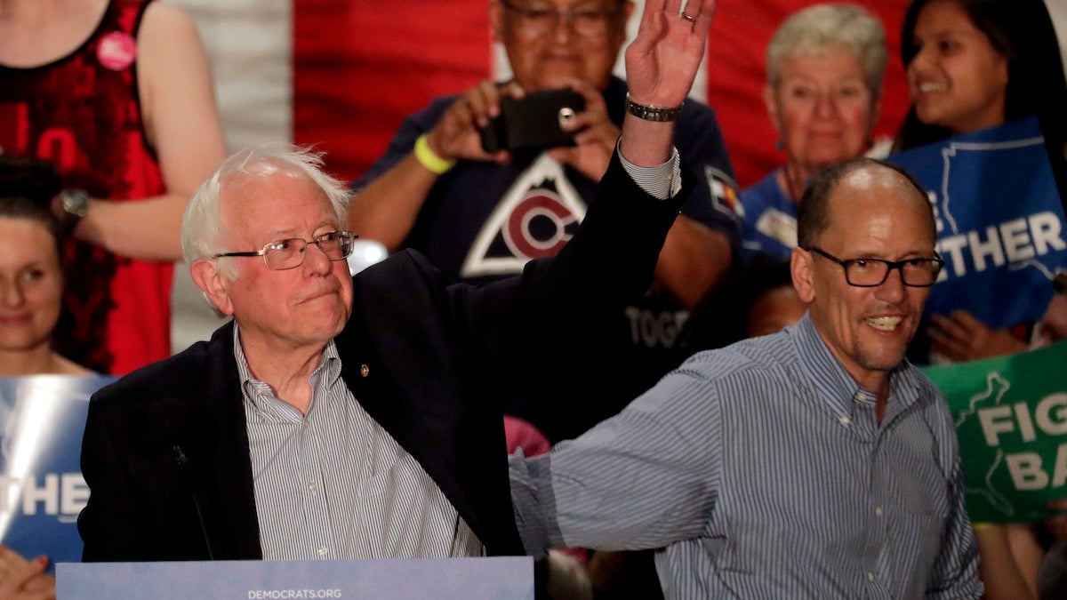  U.S. Sen. Bernie Sanders, I-Vt, left, and Democratic National Committee chairman Tom Perez, wave during a DNC rally, Friday, April 21, 2017, in Mesa, Ariz. (AP Photo/Matt York) 