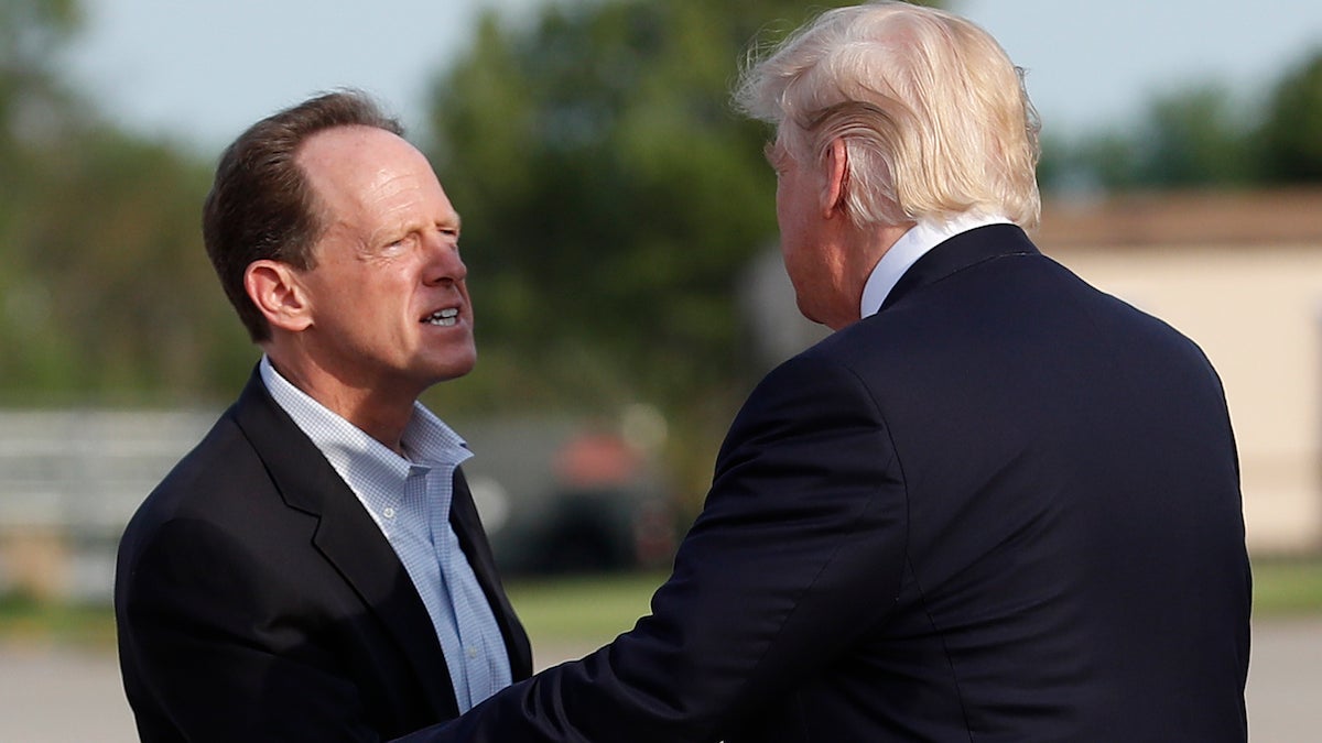  Sen. Pat Toomey, R-Pa., greets President Donald Trump as he arrives on Air Force One at Harrisburg International Airport in Middletown, Pennsylvania. (AP Photo/Carolyn Kaster) 