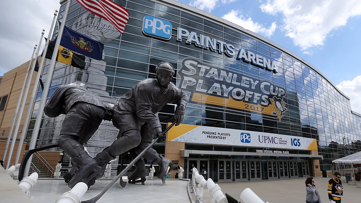  Fans walk past the entrance to PPG Paints Arena before Game 1 of the Eastern Conference final in the NHL hockey Stanley Cup playoffs between the Pittsburgh Penguins and the Ottawa Senators, Saturday, May 13, 2017, in Pittsburgh. (AP Photo/Keith Srakocic) 