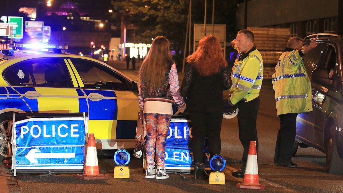  Police work at Manchester Arena after reports of an explosion at the venue during an Ariana Grande gig in Manchester, England Monday, May 22, 2017. Several people have died following reports of an explosion Monday night at an Ariana Grande concert in northern England, police said. A representative said the singer was not injured. (Peter Byrne/PA via AP) 