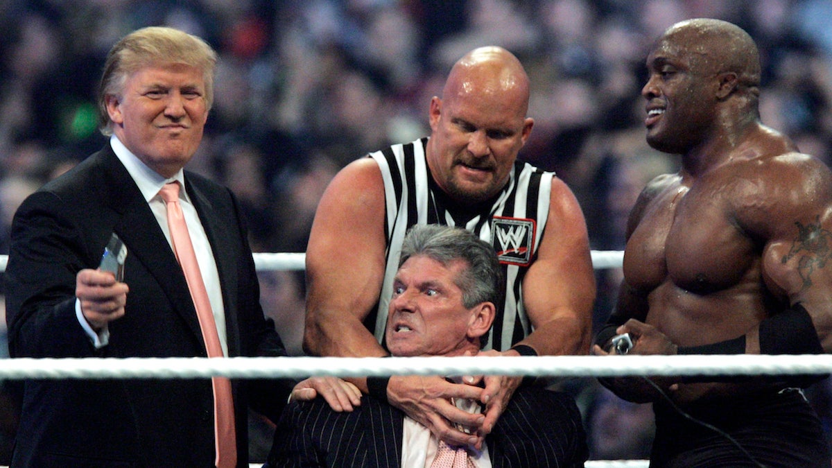  In this Sunday, April 1, 2007, file photo, WWE Chairman Vince McMahon, center, held by 