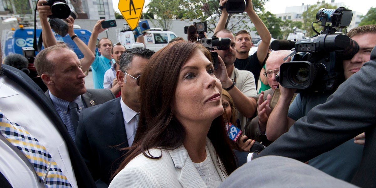 Pennsylvania Attorney General Kathleen Kane arrives to be processed and arraigned on charges she leaked secret grand jury material and then lied about it under oath on Saturday at the Montgomery County detective bureau in Norristown.
(AP Photo/Matt Rourke)