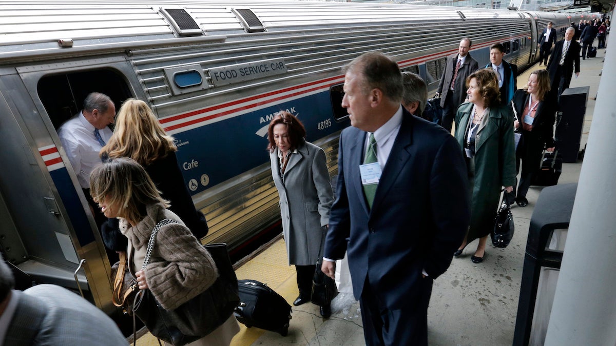  People head to assigned cars to board the annual New Jersey Chamber of Commerce’s 'Walk to Washington' train at the Trenton train station Thursday, Feb. 25, 2016, in Trenton, N.J. The Amtrak train gets its name from the idea that state lawmakers, lobbyists and business leaders walk up and down the train isles, networking, all the way from Newark to the nation's capital in a train chartered by the New Jersey Chamber of Commerce. (AP Photo/Mel Evans) 