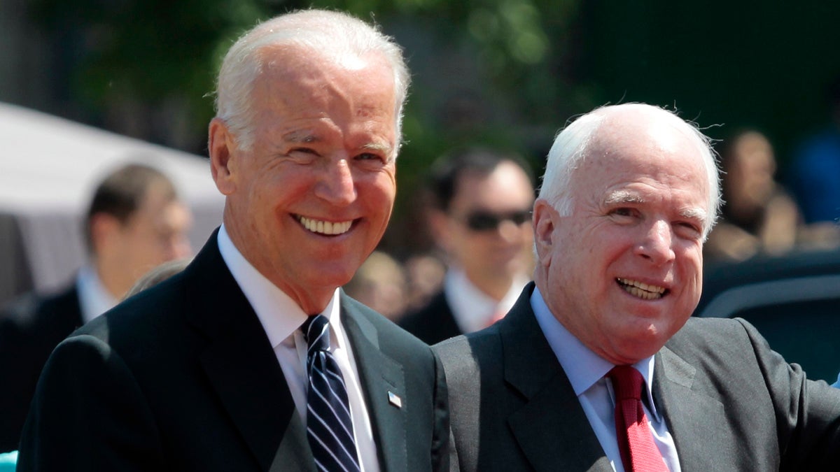  U.S. Vice President Joe Biden, (left), and U.S. Sen. John McCain, R-Ariz. (Sergei Chuzavkov/AP Photo, file) 