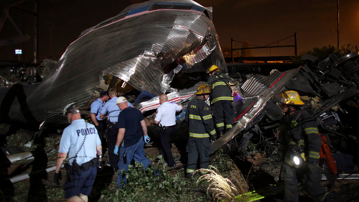  Emergency personnel work the scene of a train wreck May 12 in Philadelphia after an Amtrak train headed to New York City derailed and crashed. (AP Photo/Joseph Kaczmarek) 