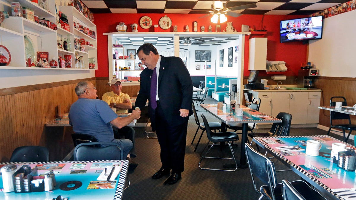  Republican presidential candidate New Jersey Gov. Chris Christie shakes hands with a potential voter at the Pink Cadillac Diner before a campaign town hall meeting last week  in Rochester, New Hampshire. (AP Photo/Elise Amendola) 