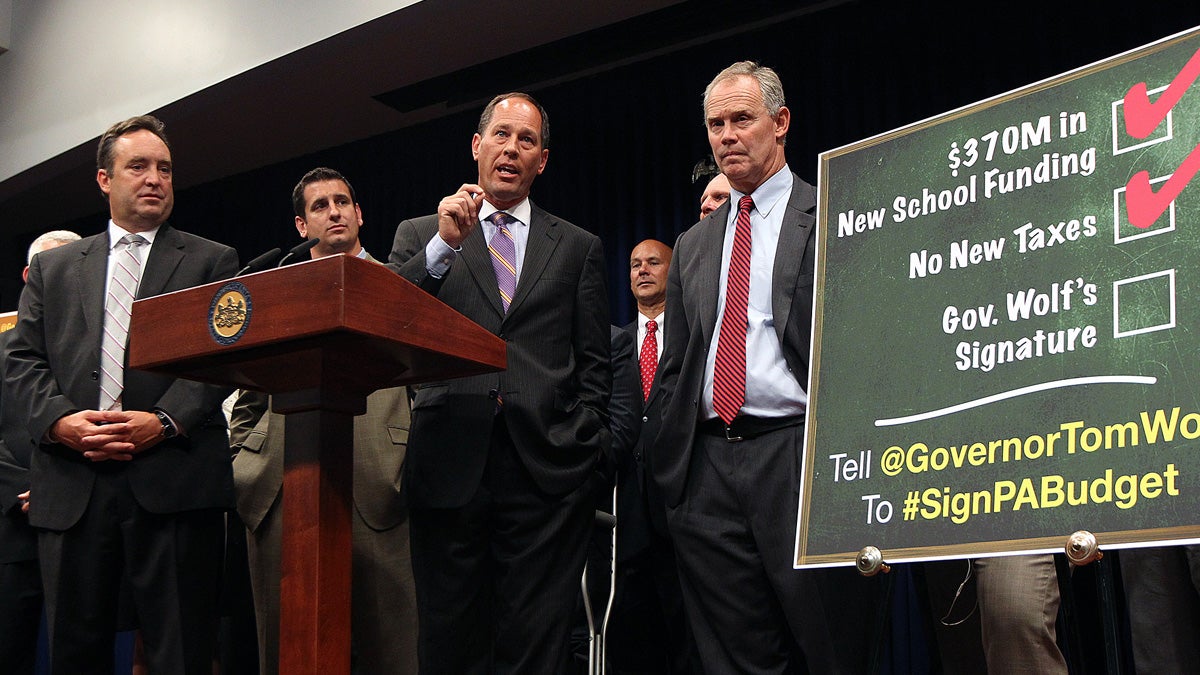 Sen. Jake Corman, R-Centre, left, House Majority Leader Dave Reed, R-Indiana, Senate President Pro Tem Joseph Scarnati, R-Jefferson, and Speaker of the House Mike Turzai, R-Allegheny, lead a news conference after Republican leaders engineered passage of the budget, liquor privatization, and pension bills, at the state Capitol in Harrisburg, Pennsylvania. (AP Photo/Chris Knight) 