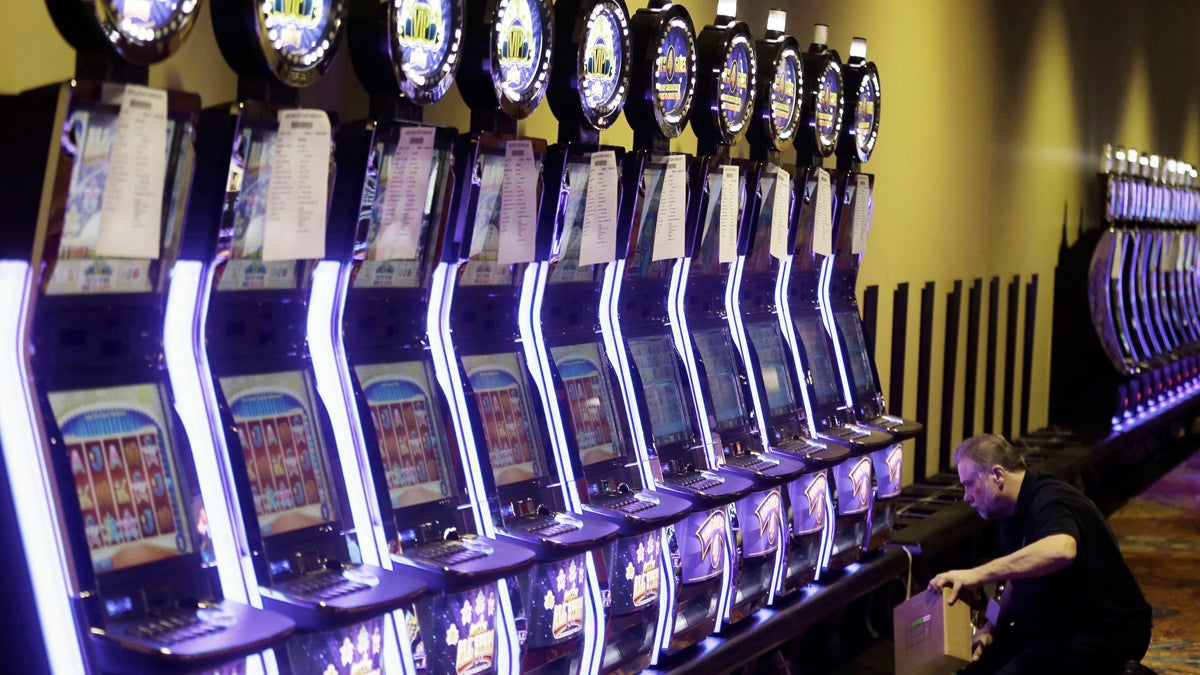  A worker checks an array of video gambling terminals  at Thistledown Racino in North Randall, Ohio. Pennsylvania lawmakers are considering legalizing the video gambling terminals in bars and other businesses.(AP file photo) 
