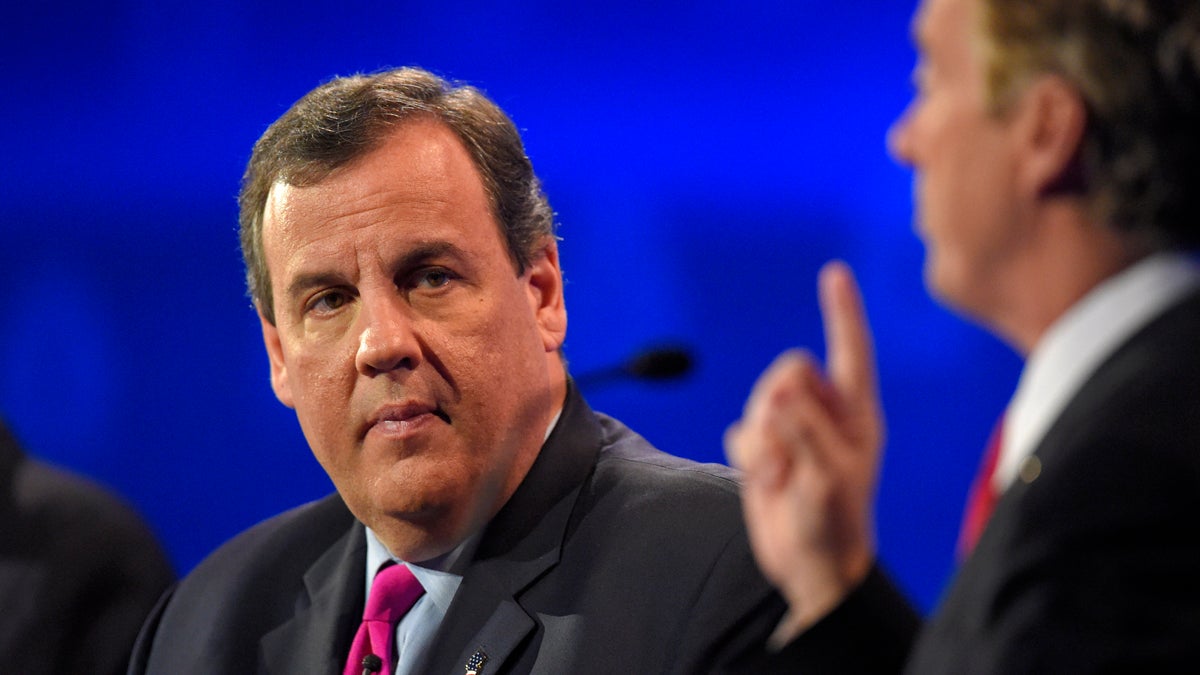  New Jersey Gov. Chris Christie listens to Sen. Rand Paul make a point during last month's GOP presidential debate in Colorado. For Tuesday's debate, Christie has been demoted to the preliminary event, sharing a stage with former Louisiana Gov. Bobby Jindal, former Arkansas Gov. Mike Huckabee and former U.S. Sen. Rick Santorum of Pennsylvania. (AP photo/Mark J. Terrill) 