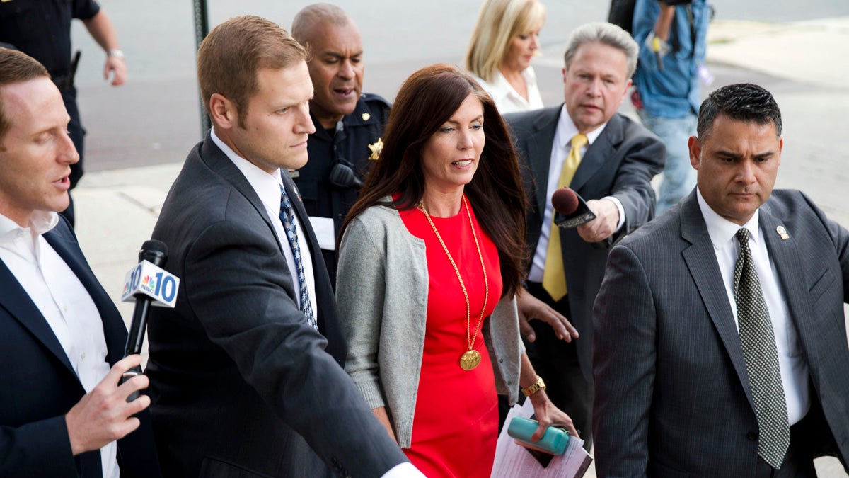  Pennsylvania Attorney General Kathleen Kane departs after her preliminary hearing Monday at the Montgomery County courthouse in Norristown. Kane is accused of leaking secret grand jury information to the press, lying under oath and ordering aides to illegally snoop through computer files to keep tabs on an investigation into the leak. (AP photo/Matt Rourke) 