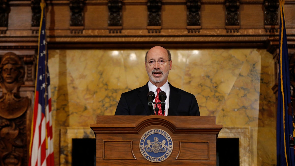  Pennsylvania Gov. Tom Wolf speaks with members of the media Tuesday at the state Capitol in Harrisburg. Wolf says he is rejecting parts of a $30.3 billion state budget plan that's already a record six months overdue, but he's freeing up more than $23 billion in emergency funding. (AP Photo/Matt Rourke) 