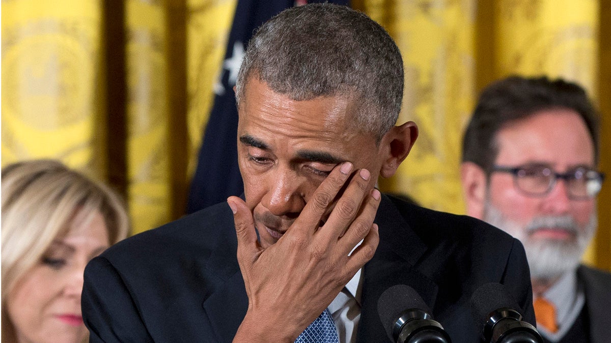 President Barack Obama wipes away tears from his eyes as he recalled the 20 first-graders killed in 2012 at Sandy Hook Elementary School
