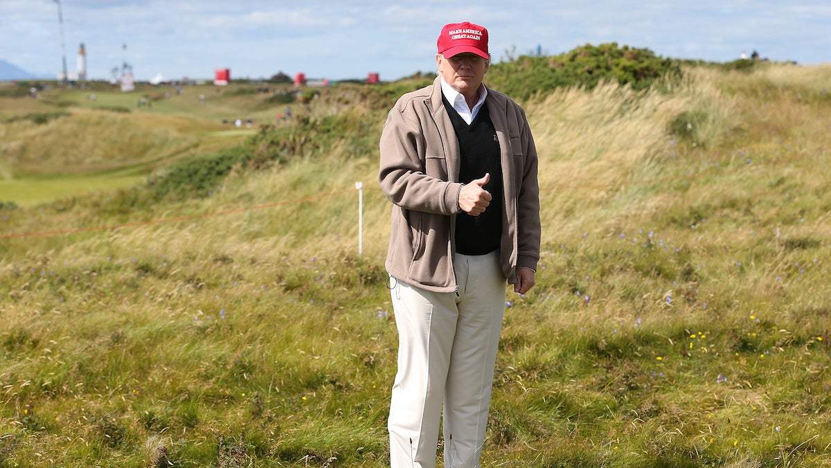  Presidential contender Donald Trump gestures to the media on the 17th fairway on the first day of the Women's British Open golf championship on the Turnberry golf course in Turnberry, Scotland, Thursday, July 30, 2015. (AP Photo/Scott Heppell) 