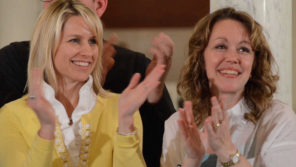 Mama bears Christine Brann (left) of Hummelstown and Angela Sharrer of New Oxford applaud lawmakers in the Pennsylvania Capitol after the state House of Representatives voted to send medical marijuana legislation to Gov. Tom Wolf's desk. They each  have a child who suffers from a severe form of epilepsy that they believe can be helped by a marijuana oil extract that is soon to be legal in Pennsylvania. (AP Photo/Marc Levy)