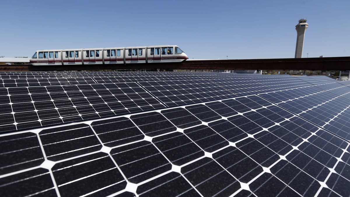 Solar panels on the roof of the building supplying energy to the AirTrain at Newark Liberty International Airport soak up the rays. A New Jersey lawmaker wants the state to aim for 80 percent renewable energy use by 2050. (AP file photo)