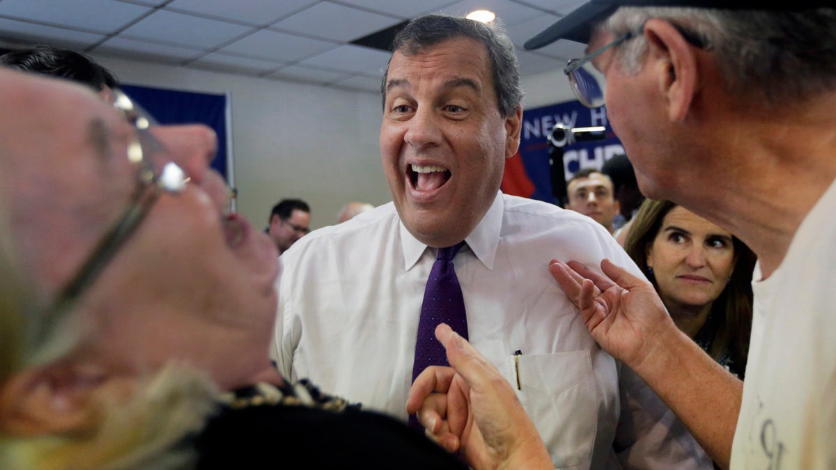  Republican presidential candidate, New Jersey Gov. Chris Christie laughs with potential voters as his wife, Mary Pat, watches at right, after a campaign town hall meeting Thursday in Rochester, New Hampshire. (AP Photo/Elise Amendola) 