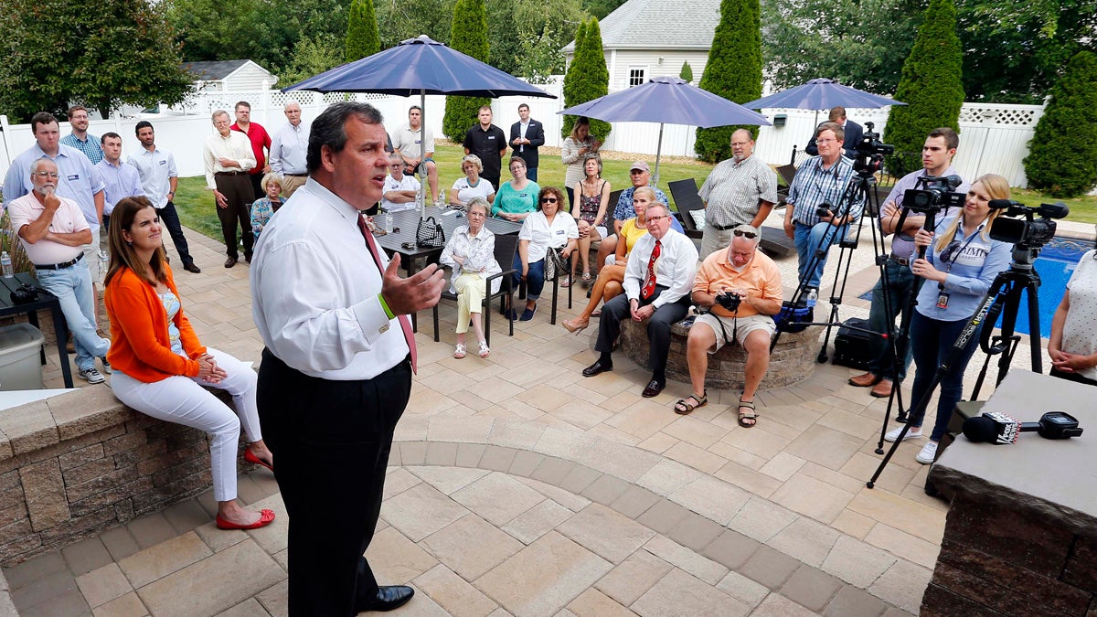  Republican presidential candidate New Jersey Gov. Chris Christie talks to supporters in the backyard of a house party in Salem, New Hampshire, last week as his wife, Mary Pat, left, looks on. (Winslow Townson/AP Photo) 