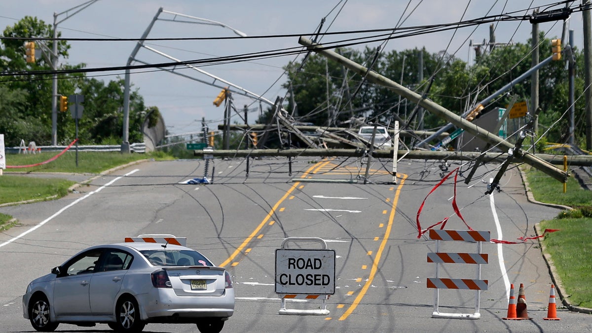  A driver turns her car at a closed road Wednesday after a violent storm downed poles and power lines Tuesday night in Gibbstown, New Jersey. Gloucester, Camden, Burlington and Salem counties saw the most damage from the ferocious storms that barreled through the region Tuesday night. (Mel Evans/AP Photo) 