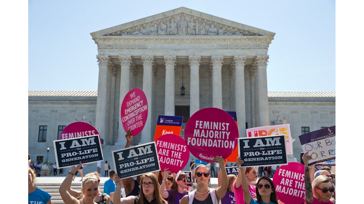  Demonstrators on both sides of the abortion issue stand in front of the Supreme Court in Washington Monday as the court announced several decisions. (Alex Brandon/AP Photo) 