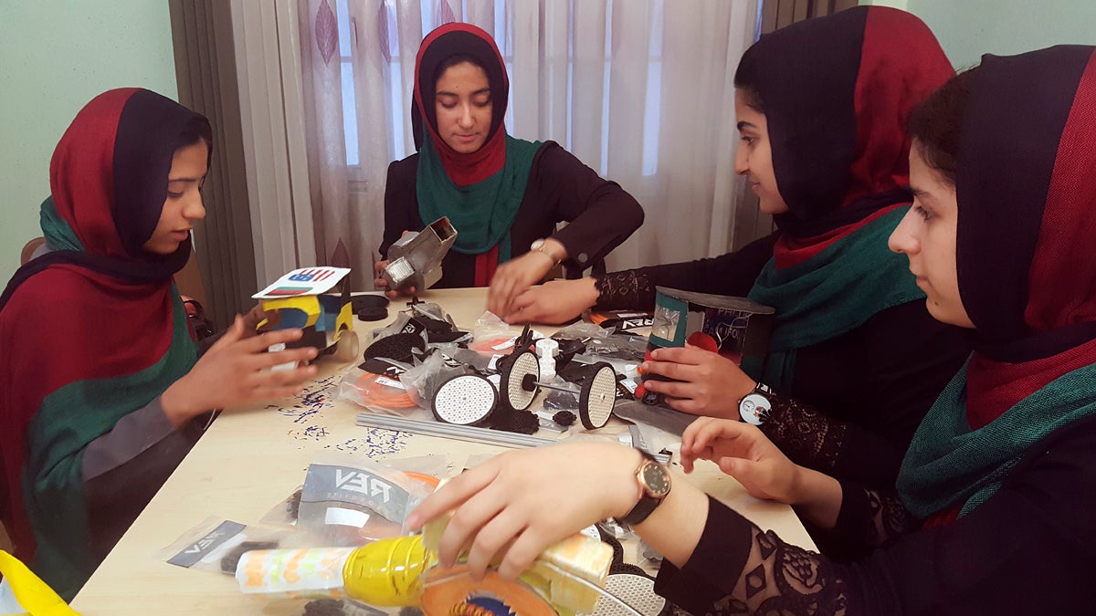  In this Thursday, July 6, 2017, file photo, teenagers from the Afghanistan Robotic House, a private training institute, practice at the Better Idea Organization center, in Herat, Afghanistan. U.S. President Donald Trump intervened to allow the group of Afghan girls into the country to participate in a robotics competition. (Ahmad Seir/AP Photo, file) 