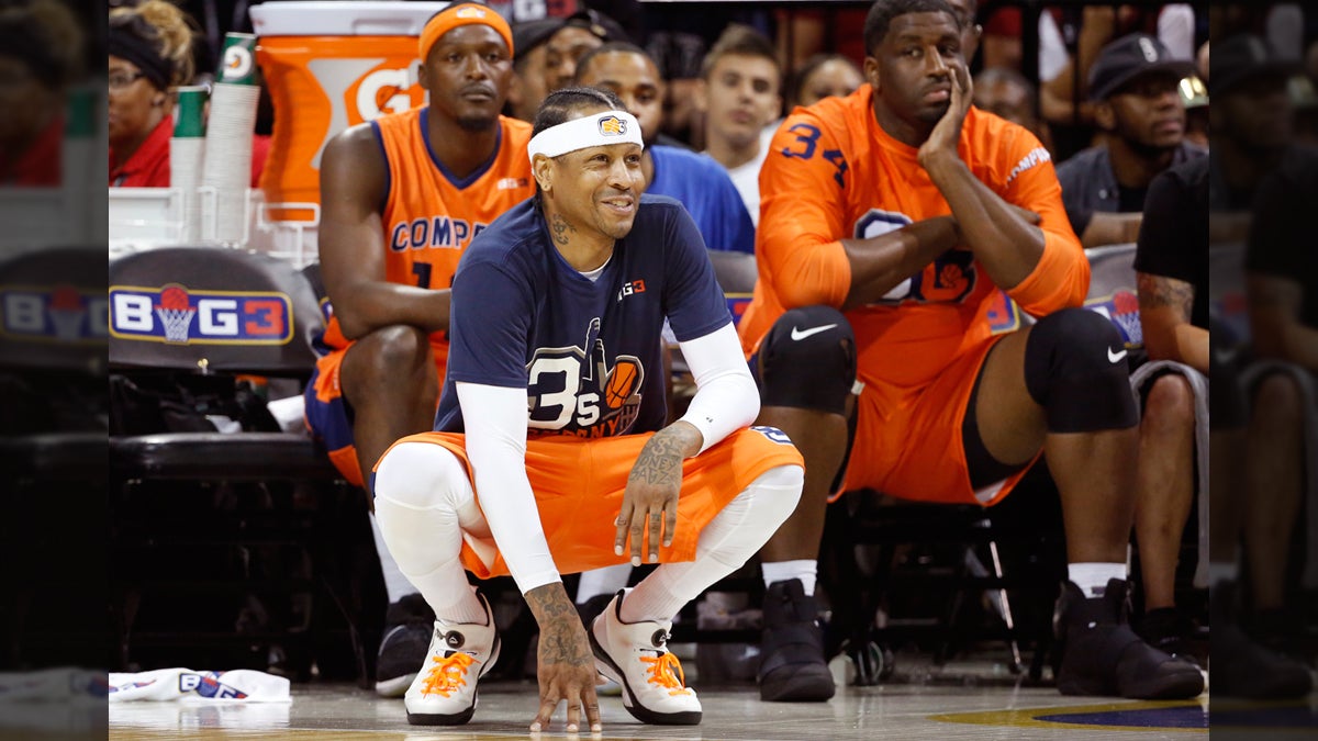  3's Company player/captain and coach Allen Iverson, (center), kneels on the sideline during the first half of Game 3 in the BIG3 Basketball League debut, Sunday, June 25, 2017, at the Barclays Center in New York. (Kathy Willens/AP Photo) 