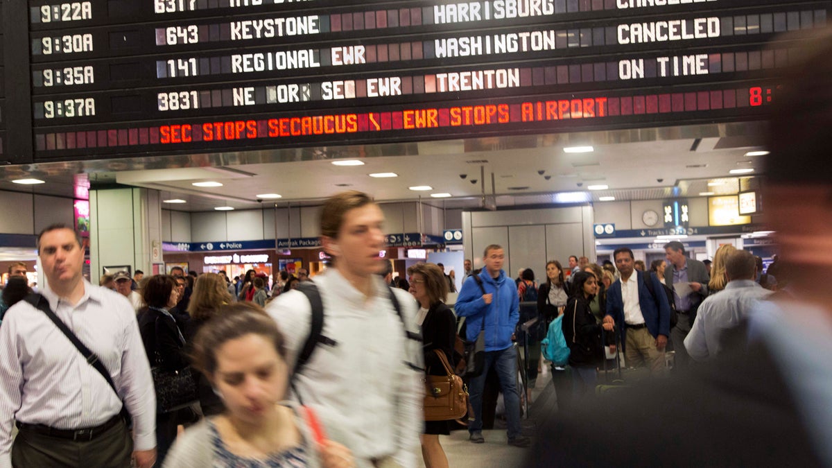 apamtrakphillyx1200 Travelers walk through New York's Penn Station, Wednesday. (Mark Lennihan/AP Photo)