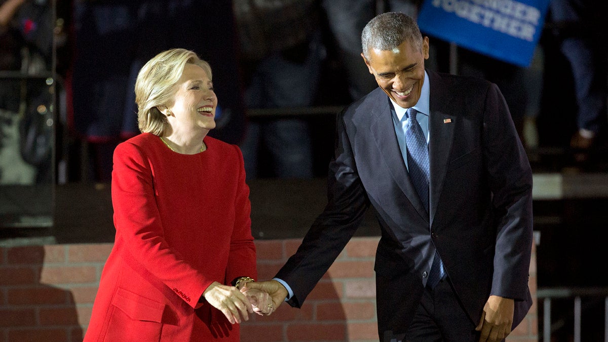  President Barack Obama and Democratic presidential candidate Hillary Clinton hold hands as they walk off stage after both spoke at a rally at Independence Mall in Philadelphia. Monday, Nov. 7, 2016. (Pablo Martinez Monsivais/AP Photo) 