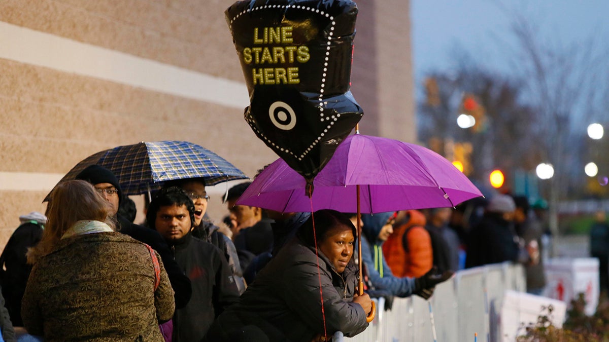  Guests wait for Black Friday sales before Target doors open at 6 p.m., Thursday, Nov. 24, 2016, in Jersey City, N.J. (Photo by Noah K. Murray/Invision for Target/AP Images) 