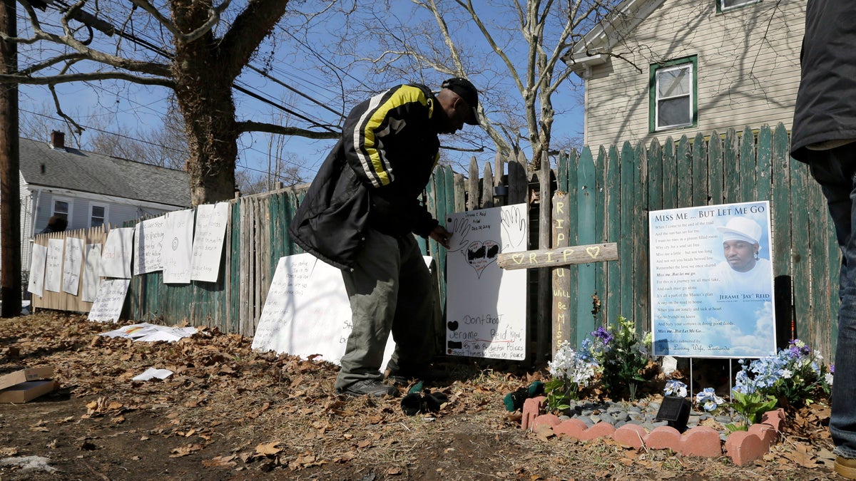  A man looks at signs near a memorial at the spot where Jerame Reid, was fatally shot by police in Bridgeton, N.J., Saturday, Feb. 28, 2015. A large group took part in a protest Saturday, which stemmed from the Dec. 30 shooting of Reid. The 36-year-old Bridgeton man was shot and killed by police during a traffic stop that was captured by a patrol car camera. (Mel Evans/AP Photo) 