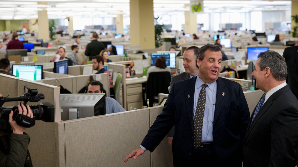  New Jersey Gov. Chris Christie tours a Fidelity Investments facility last month in Merrimack, New Hampshire. Experts say he'll have to finish among the top three Republicans in polling there next week to remain a viable presidential candidate. (Matt Rourke/AP Photo)  