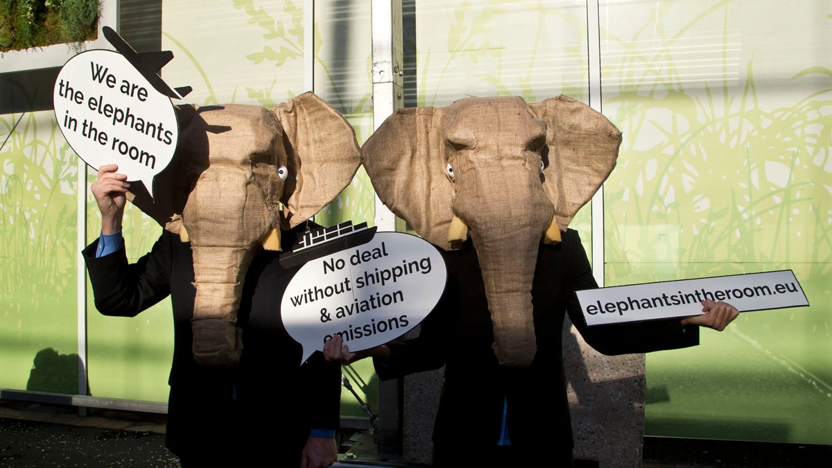 Representatives of NGOs wear elephant masks and hold banner at the COP21, United Nations Climate Change Conference, in Le Bourget north of Paris, Friday, Dec. 4, 2015. The actives wants negotiators aviation and shipping emissions include in the final accord.(Michel Euler/AP Photo) 