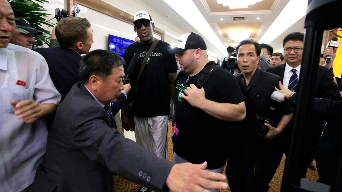  Former NBA basketball star Dennis Rodman is surrounded by North Korean officials and photographers upon his arrival at Sunan International Airport on Tuesday, June 13, 2017, in Pyongyang, North Korea. (Kim Kwang Hyon/AP Photo) 