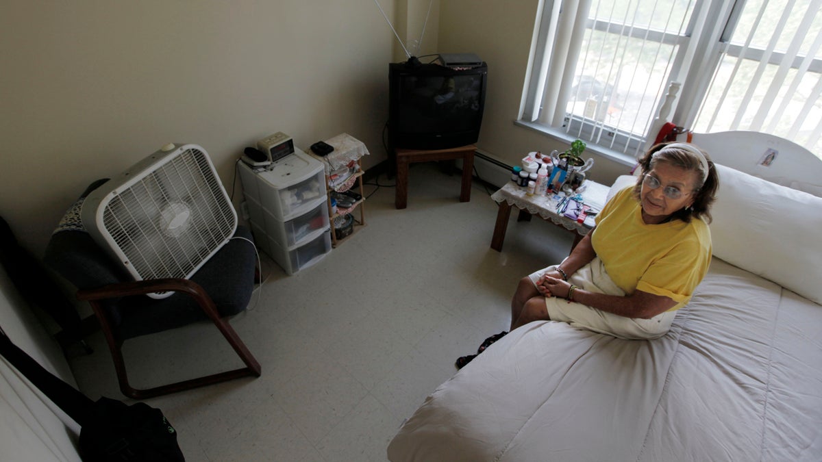  Tenant Virgina Mendoza stays cool with her fan and air conditioner, at her home in Apartamentos Las Americas during a well-being check by the Chicago Housing Authority Friday, July 6, 2012, in Chicago. (M. Spencer Green/AP Photo, file) 